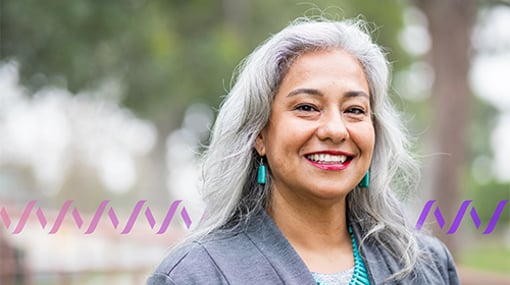 Smiling woman with wave pattern watermark behind her