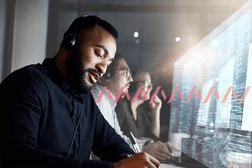 A sales agent talking to a customer on a headset